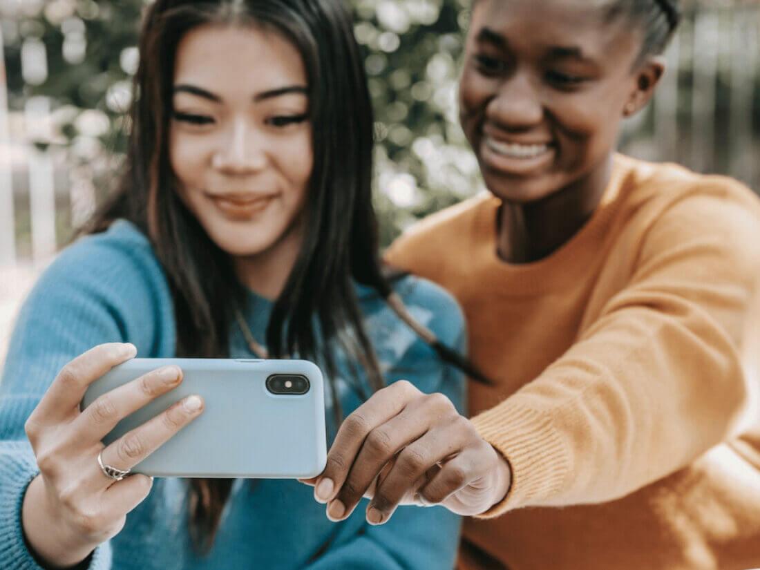 Two people taking a selfie.
